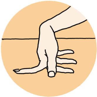 2本の指の間を開き、机などフラットな面にグイグイと押しつけてストレッチ