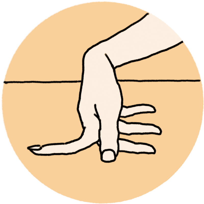 2本の指の間を開き、机などフラットな面にグイグイと押しつけてストレッチ