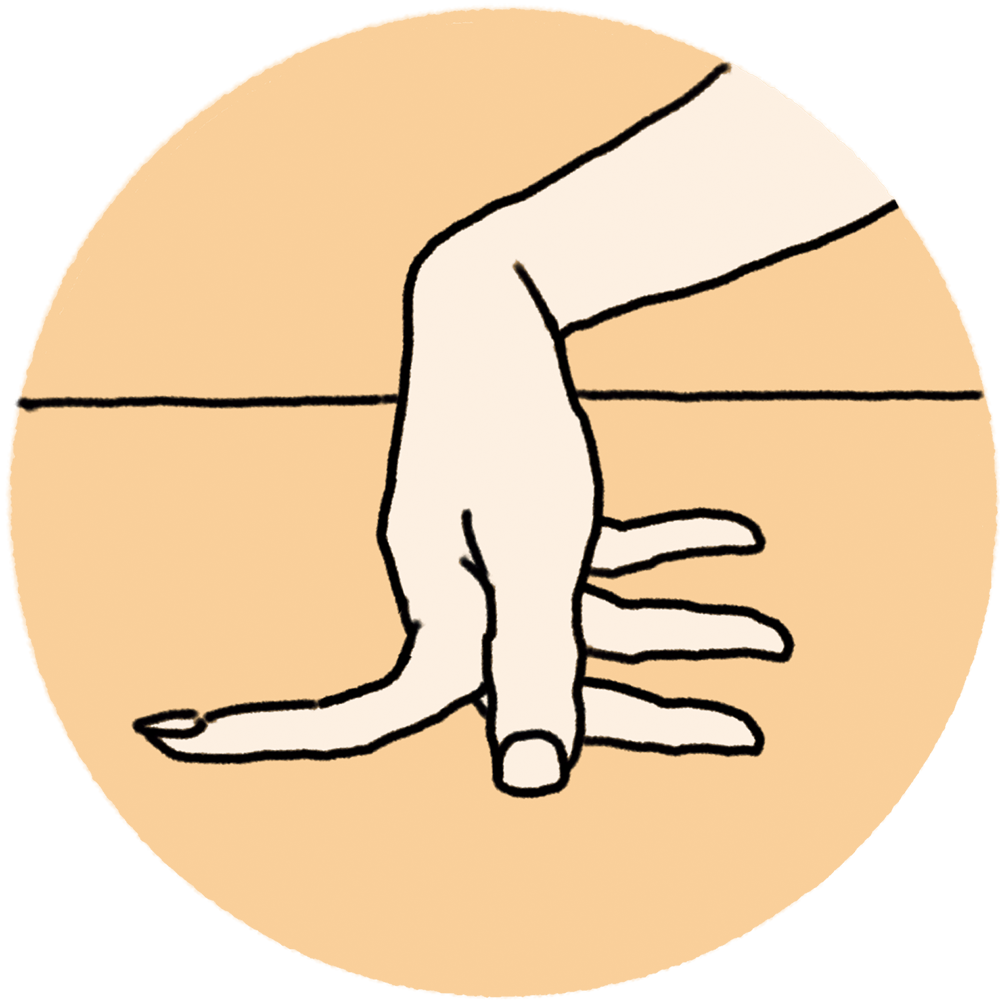 2本の指の間を開き、机などフラットな面にグイグイと押しつけてストレッチ