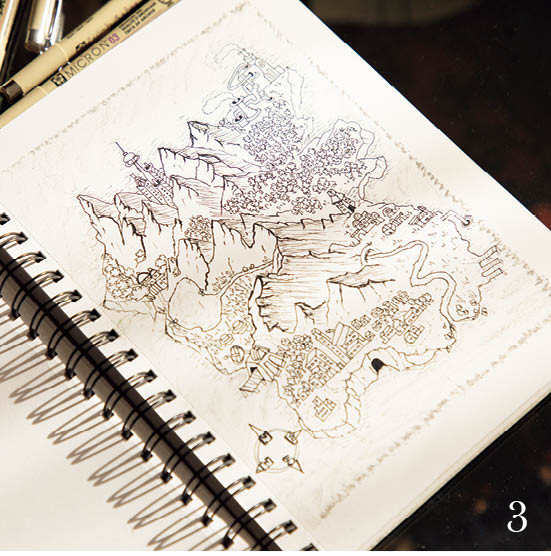 3.「空想の地図を書くのが好き」と市川さん。山並みと麓の村を繊細に表現。　